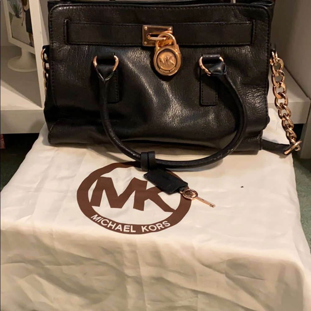 Micheal kors black and rose gold.